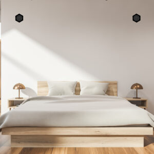 Interior of attic bedroom with white walls, wooden floor, master bed with white blanket and window with mountain view. 3d rendering